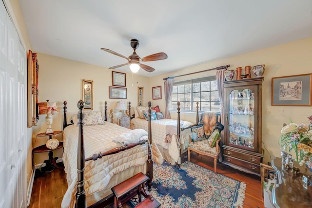 bedroom with ceiling fan and hardwood / wood-style flooring