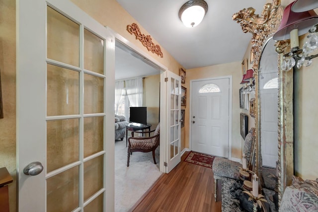 entryway featuring hardwood / wood-style flooring and french doors