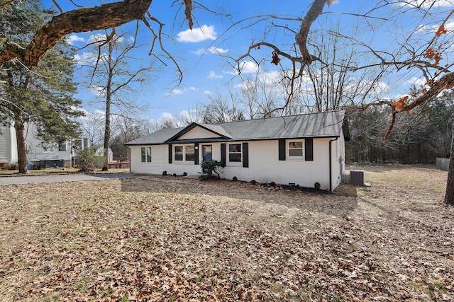 single story home featuring central air condition unit