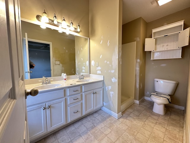 bathroom with a shower, toilet, and vanity