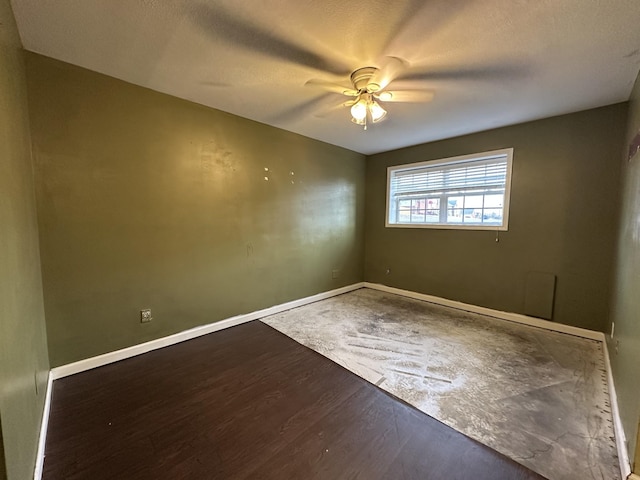 empty room featuring ceiling fan and hardwood / wood-style floors