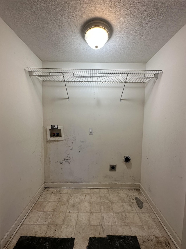 clothes washing area featuring hookup for a washing machine and electric dryer hookup