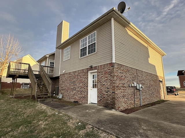 back of property featuring a deck