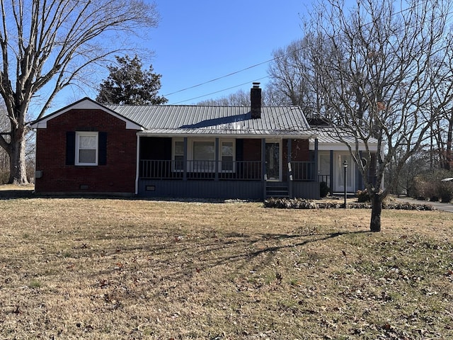 view of front of property with covered porch and a front yard