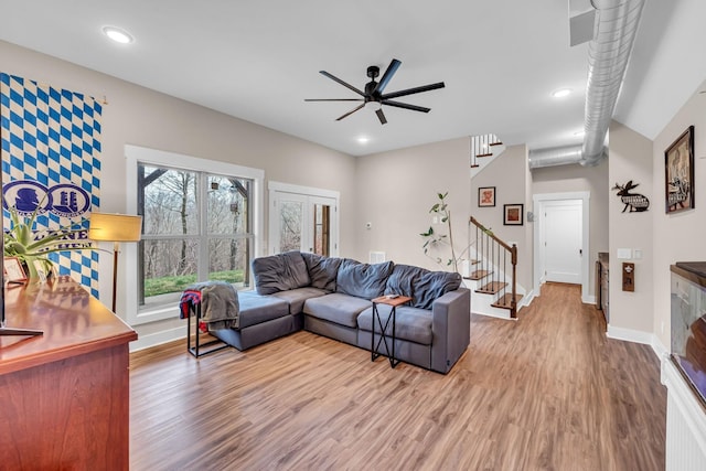 living room with ceiling fan and wood-type flooring