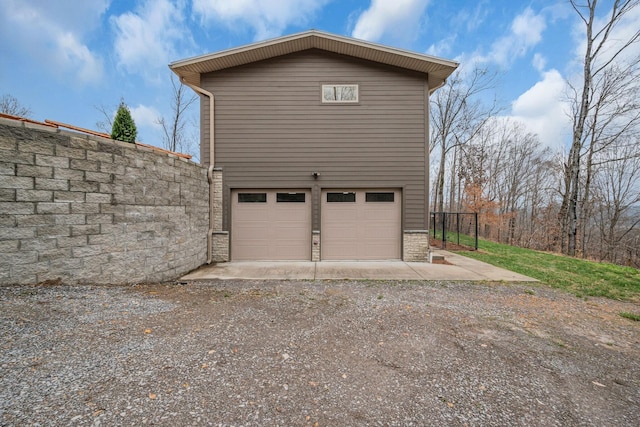 view of side of home with a garage