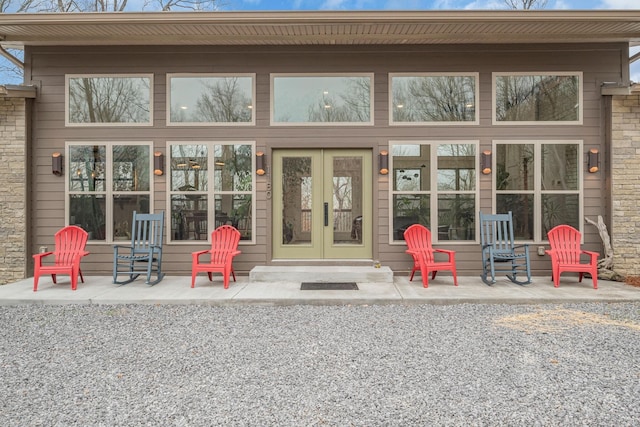 rear view of house featuring a patio area and french doors