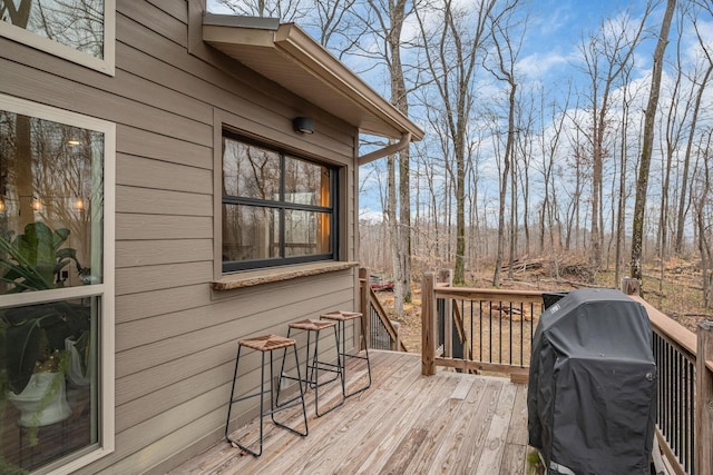 wooden deck with grilling area