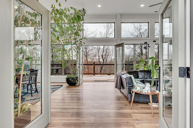 sunroom / solarium featuring a healthy amount of sunlight