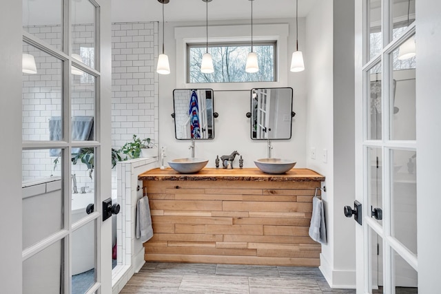 bathroom with vanity and french doors