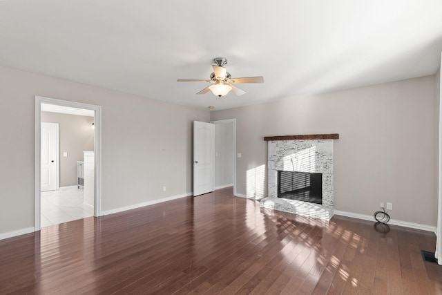 unfurnished living room with ceiling fan and hardwood / wood-style floors