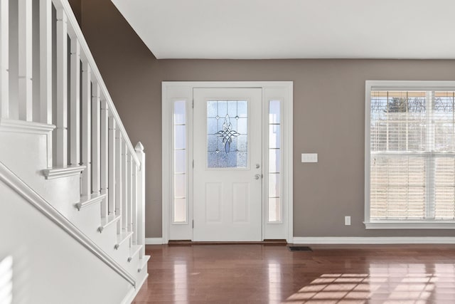 entrance foyer with dark hardwood / wood-style flooring