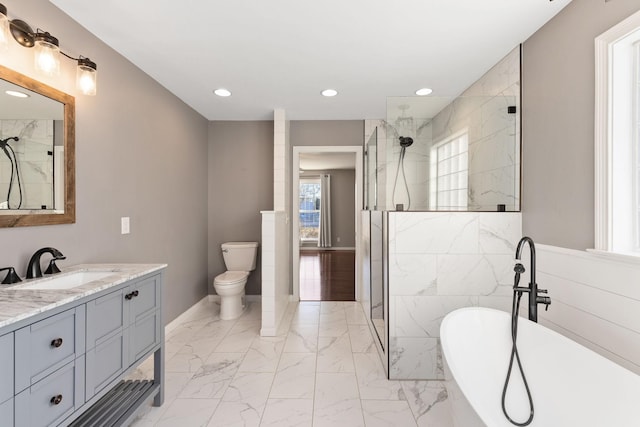 full bathroom with toilet, shower with separate bathtub, and vanity