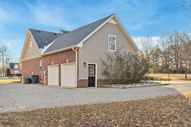 view of side of home with a garage