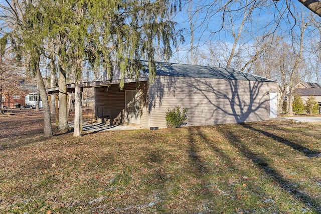 rear view of property featuring a lawn