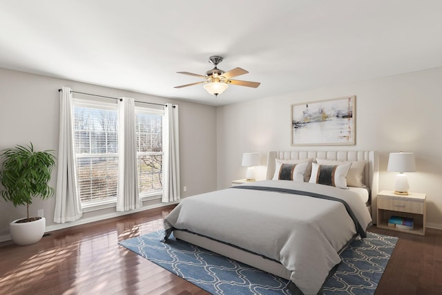 bedroom featuring ceiling fan and dark hardwood / wood-style flooring