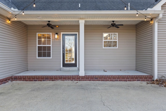 doorway to property featuring ceiling fan, covered porch, and a patio