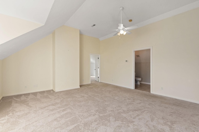 additional living space featuring ceiling fan, light colored carpet, and lofted ceiling