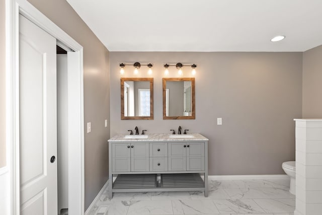 bathroom with toilet and vanity