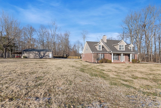 view of side of property featuring a porch and a yard