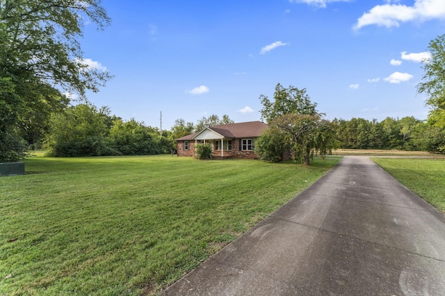 ranch-style house featuring a front lawn