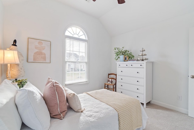 bedroom featuring ceiling fan, light carpet, and lofted ceiling