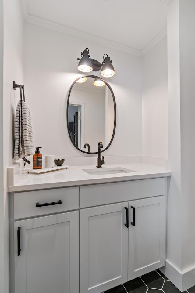 bathroom featuring crown molding, tile patterned flooring, and vanity