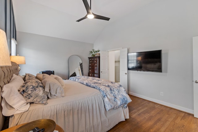 bedroom with ceiling fan, hardwood / wood-style flooring, and lofted ceiling