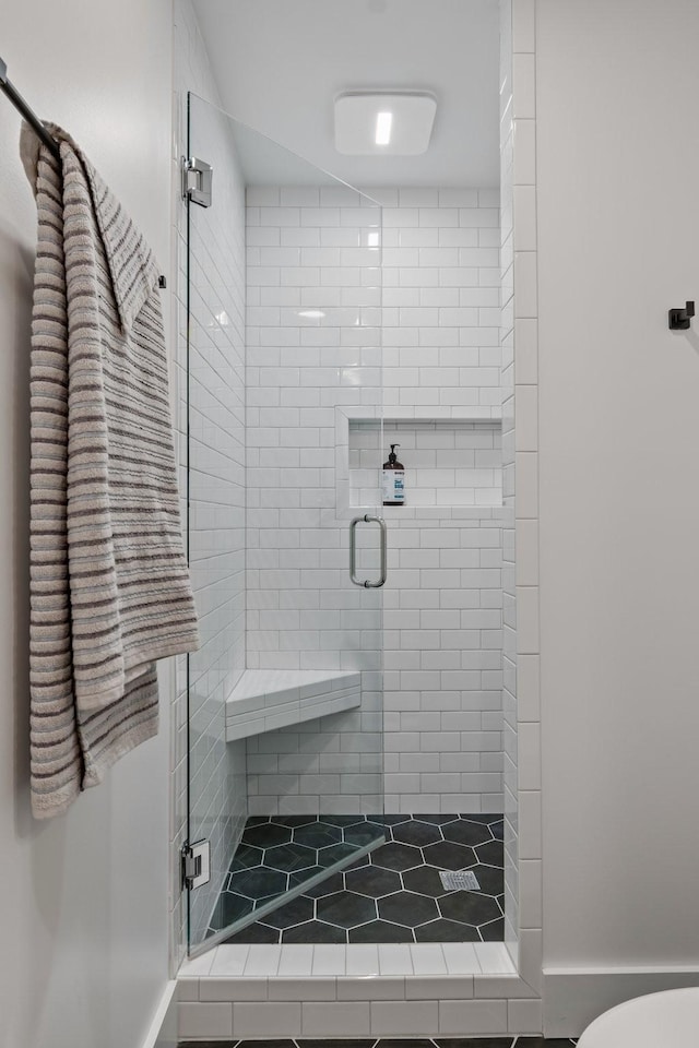 bathroom featuring an enclosed shower