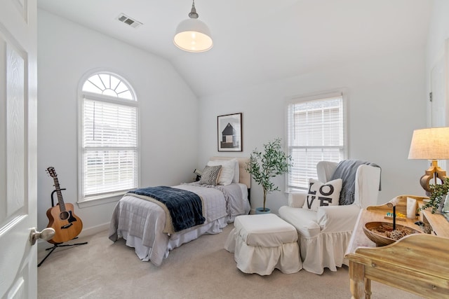 carpeted bedroom with vaulted ceiling