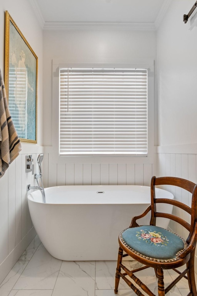 bathroom featuring a washtub and ornamental molding