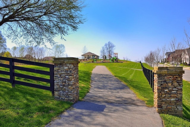 surrounding community featuring a lawn and a gazebo