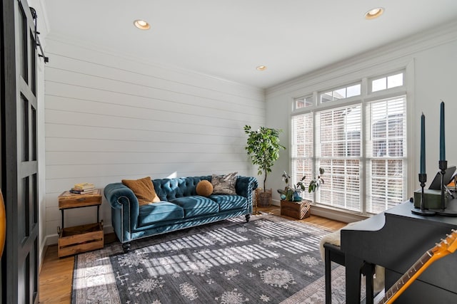 living room featuring hardwood / wood-style floors and ornamental molding