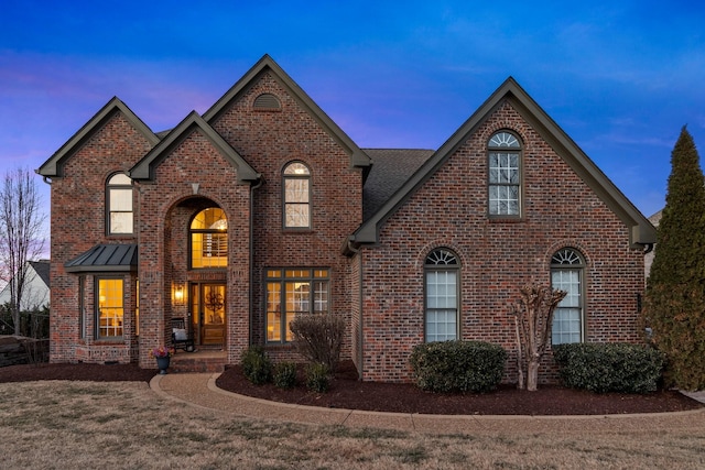 view of front of house with a yard