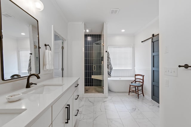 bathroom with vanity, crown molding, and separate shower and tub