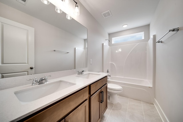 full bathroom with tile patterned floors, vanity, toilet, and shower / washtub combination