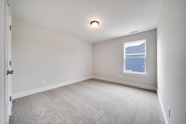 empty room featuring carpet flooring