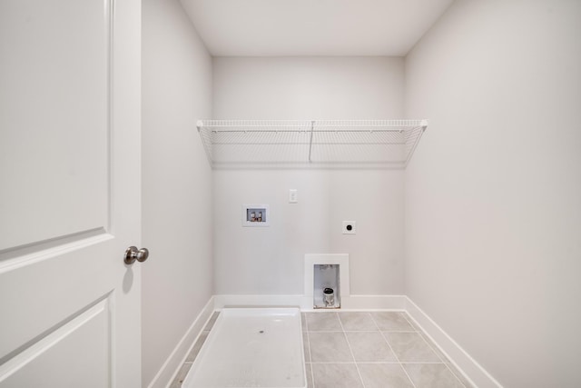 washroom featuring electric dryer hookup, washer hookup, and light tile patterned floors