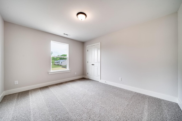 unfurnished room with carpet floors