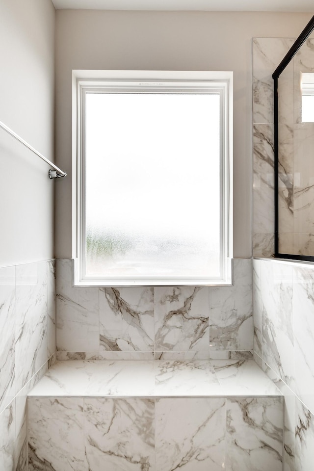 bathroom with a tile shower