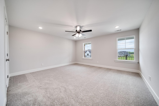 carpeted empty room with ceiling fan