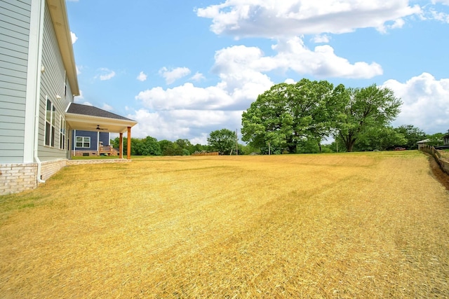 view of yard featuring ceiling fan