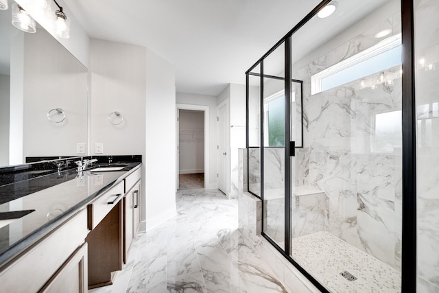 bathroom featuring vanity and a shower with shower door