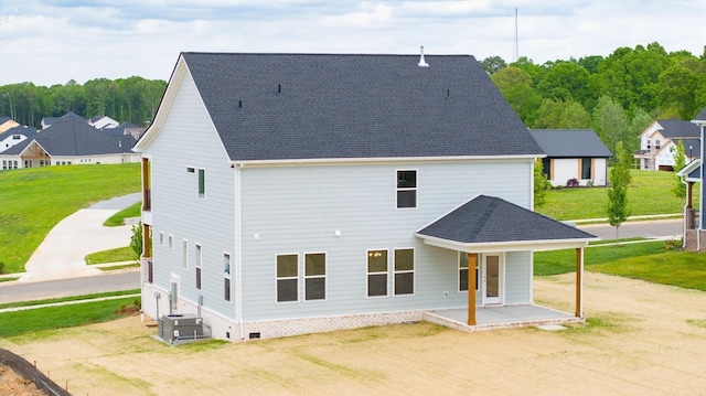 back of property with central AC unit and covered porch