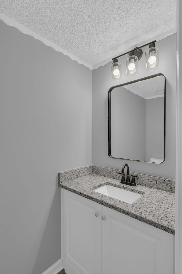 bathroom with vanity and a textured ceiling