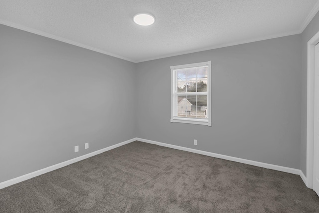 carpeted empty room with a textured ceiling