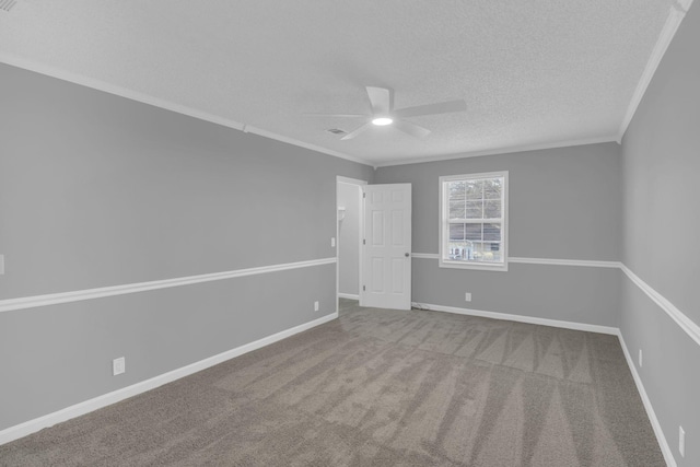 unfurnished room with carpet floors, a textured ceiling, ornamental molding, and ceiling fan