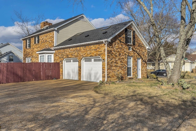 view of home's exterior with a garage