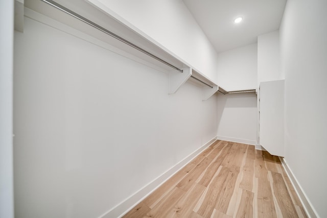 walk in closet featuring light hardwood / wood-style flooring