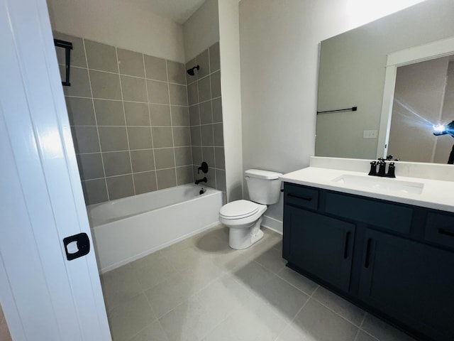 full bathroom with toilet, vanity, tiled shower / bath, and tile patterned flooring